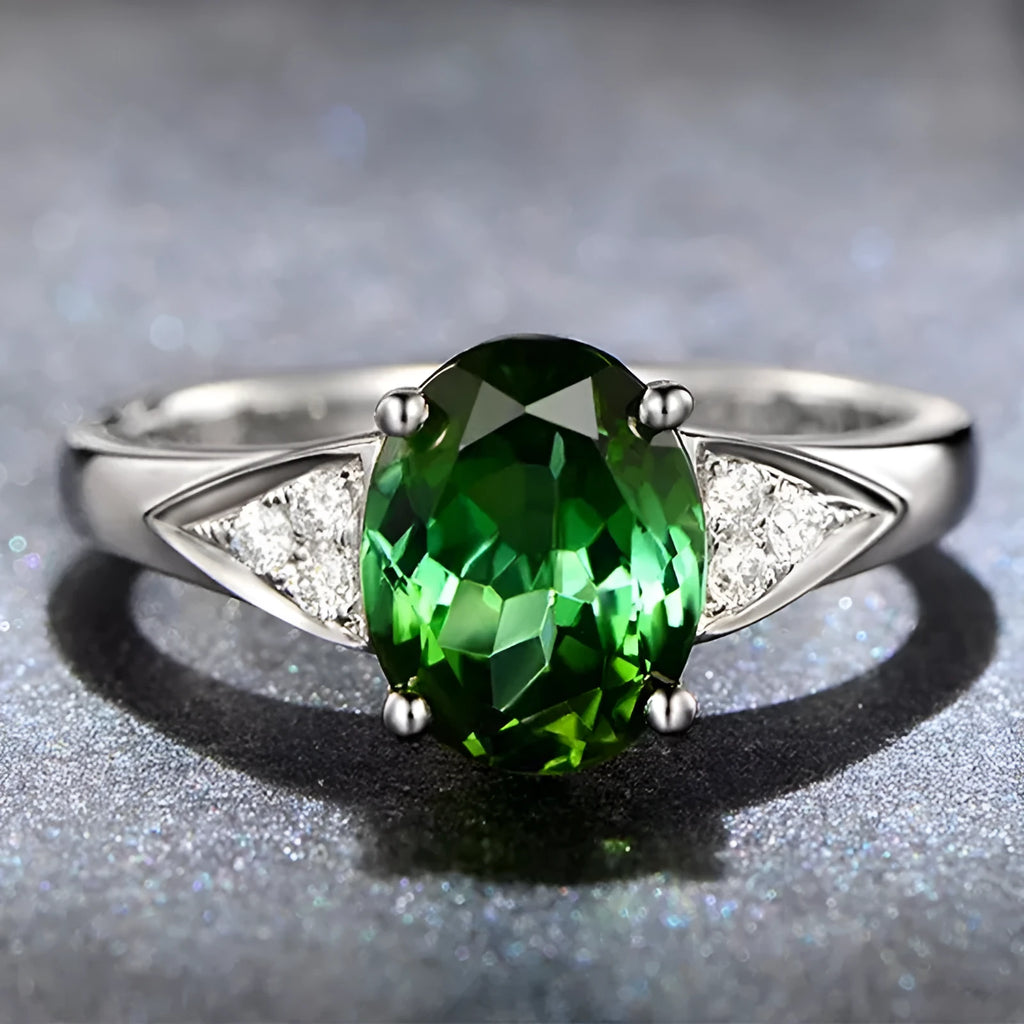 Women's sterling silver zircon ring with heart, water drop, and bell pattern, showcasing a blue zircon stone.