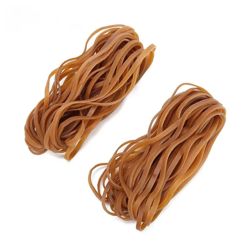 A pile of natural-coloured, round rubber rings next to a 500g bag.