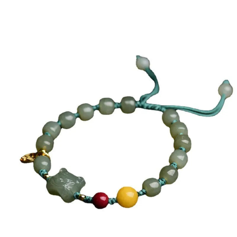 Natural Hetian Jade bracelet with cinnabar and beeswax beads, animal zodiac motifs, and sequin details on a string