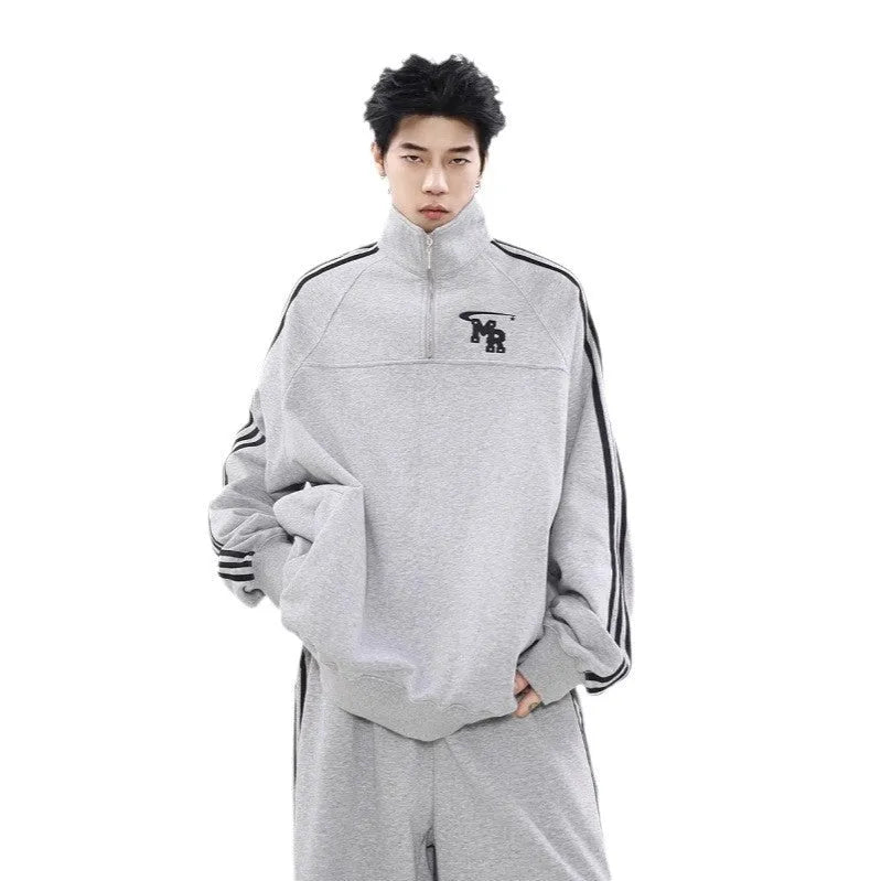 Black Hong Kong style men's polyester hoodie coat with stand collar and long sleeves.