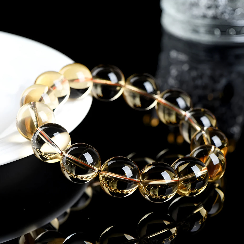 Natural citrine scattered beads ball bracelet on a wrist, showing polished stones in a choice of colours and sizes.