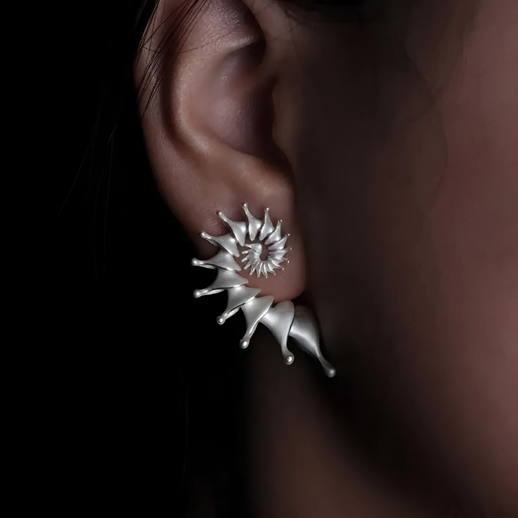 Conch colour three-dimensional matte alloy stud earrings with irregular geometric design