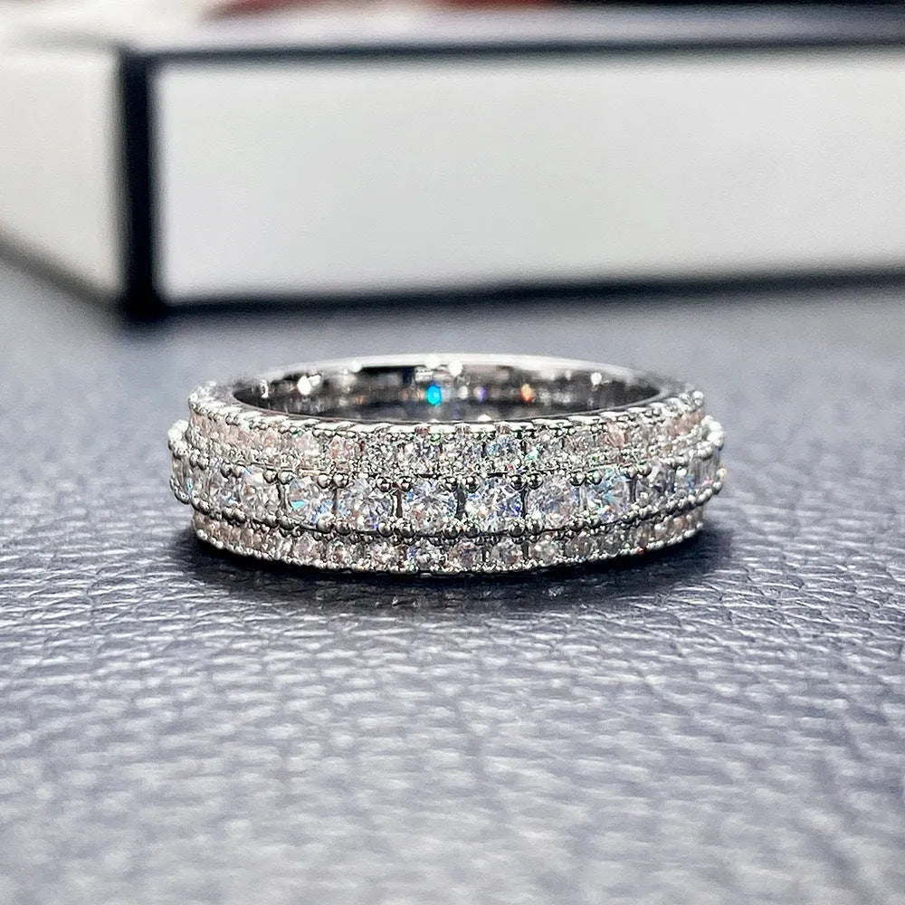 Geometric triangular personalised engagement ring with zircon stones in gold and platinum colour finishes.
