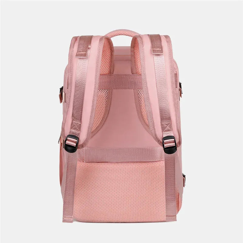 Large purple women's travel backpack with multiple pockets and air pillow belt on a grey background