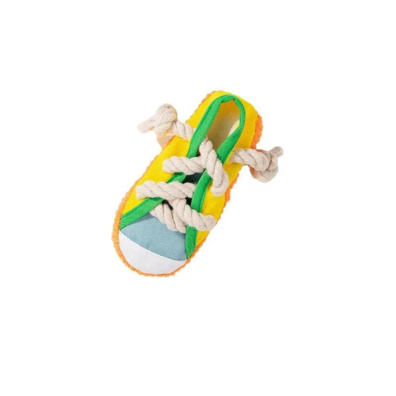 Yellow plastic dog slipper chew toy with a self-hi sound feature for biting.