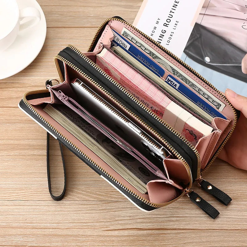 Long black PU leather wallet clutch with phone slot, card holders, and zippered coin purse