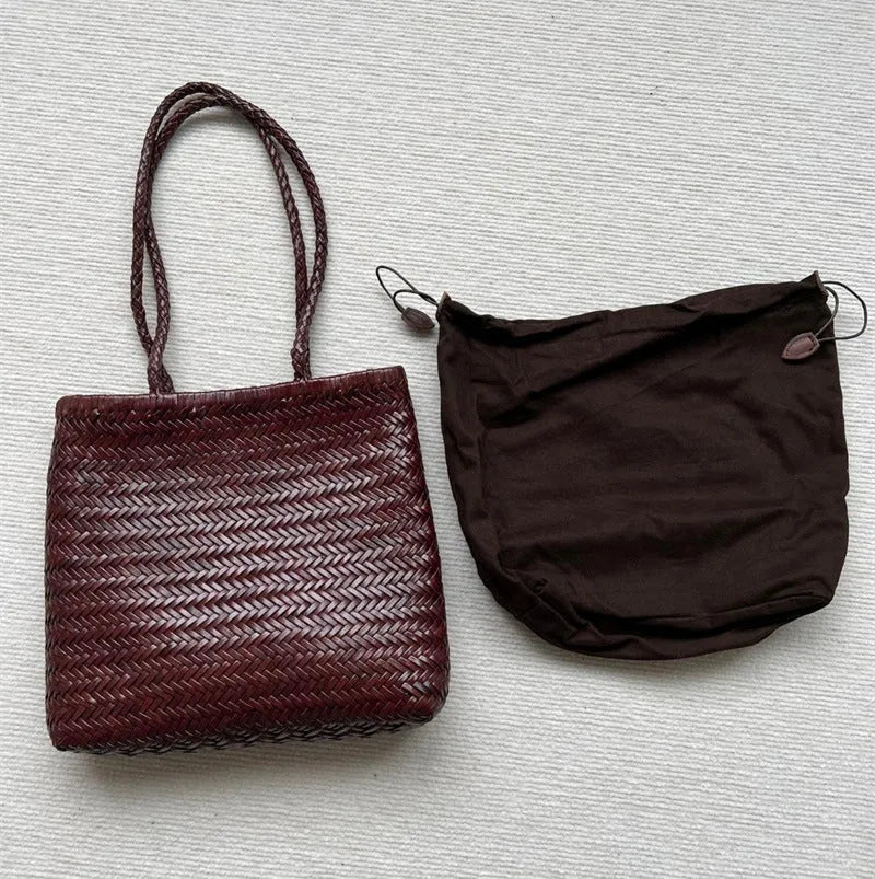 Brown woven leather tote bag with three-dimensional pocket and shoulder strap
