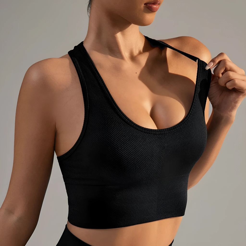Black women's cross-back sports bra with moulded cups on a mannequin.