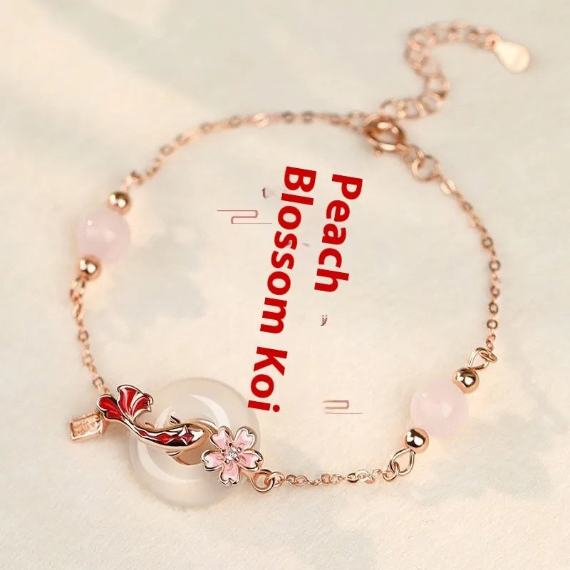 S925 sterling silver bracelet with white chalcedony flower and koi fish design in New Chinese style.