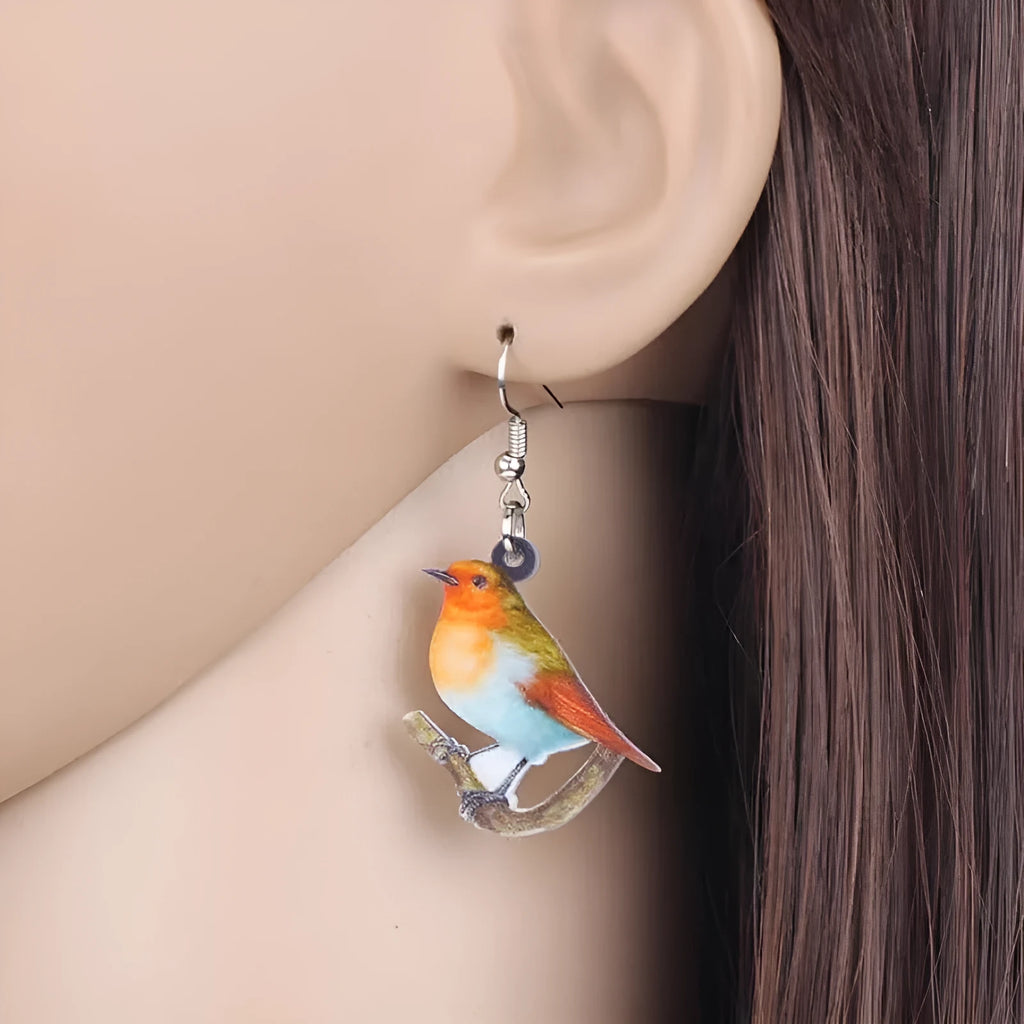 Blue Titmouse and snake design acrylic pendant earrings with geometric animal zodiac styling