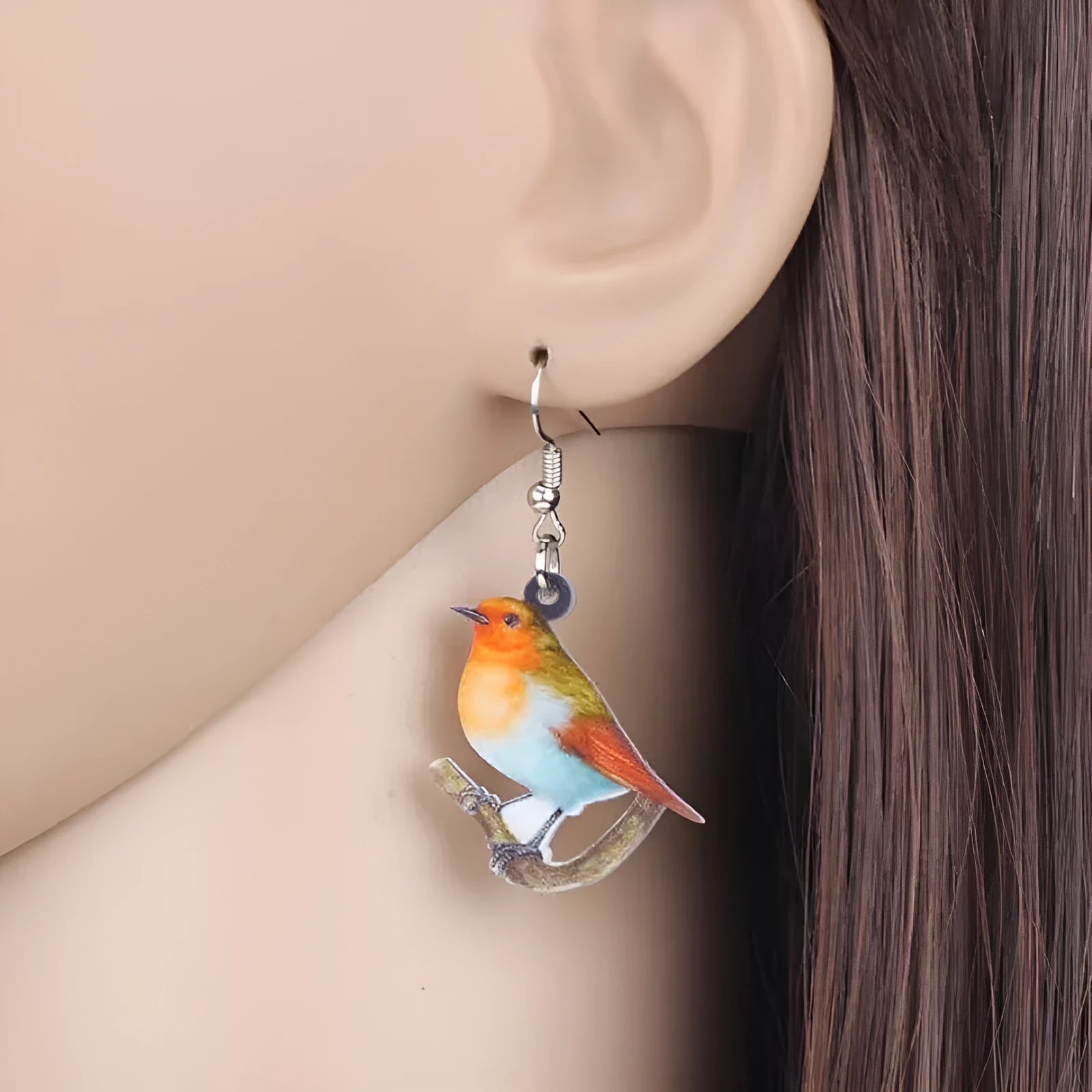 Blue Titmouse and snake design acrylic pendant earrings with geometric animal zodiac styling