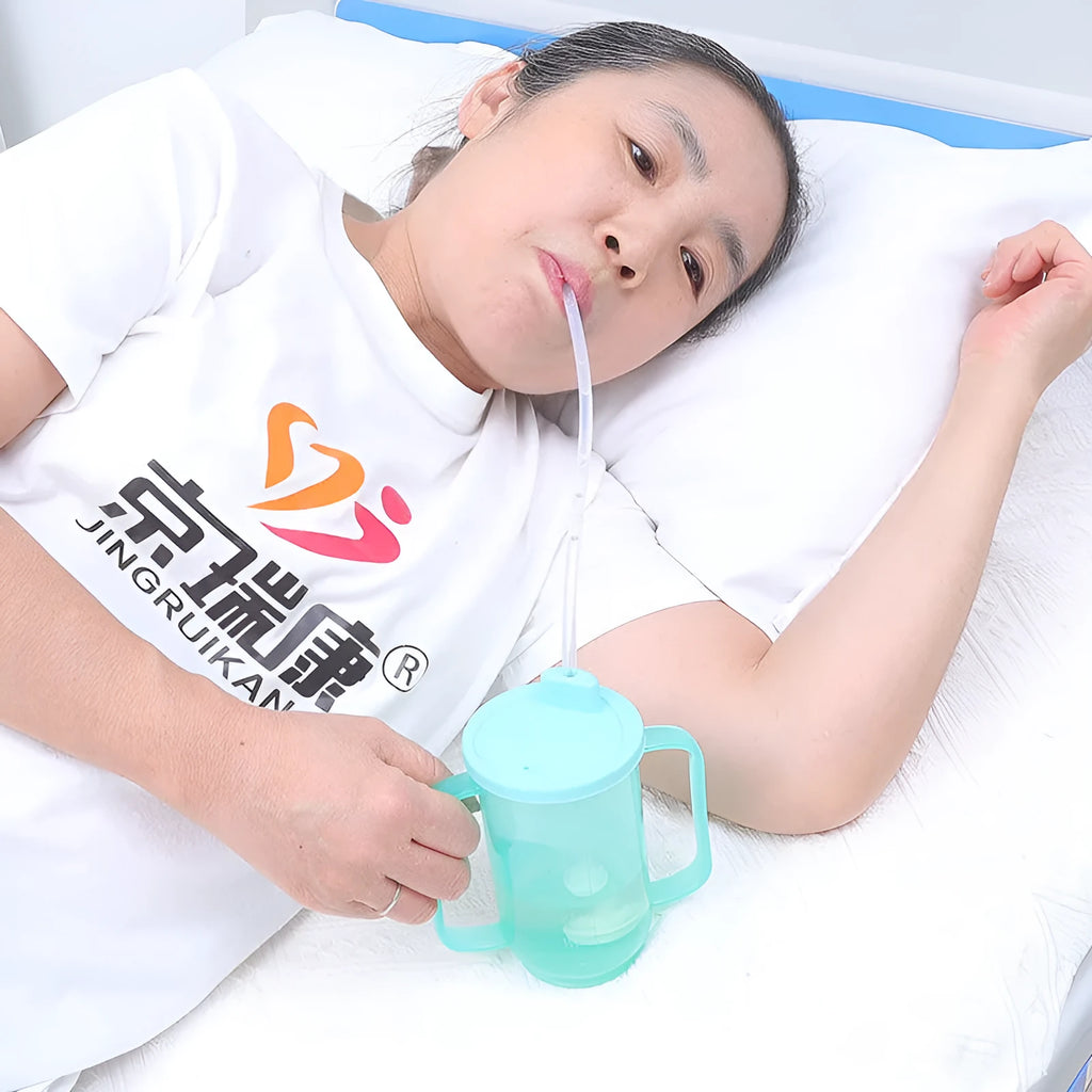 Elderly anti-choke drinking cup with handle and oblique mouth design for bed use