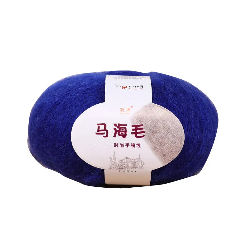 Ball of mohair wool for DIY scarf knitting kit in one of 34 colours including blue, pink, green, grey, and black.