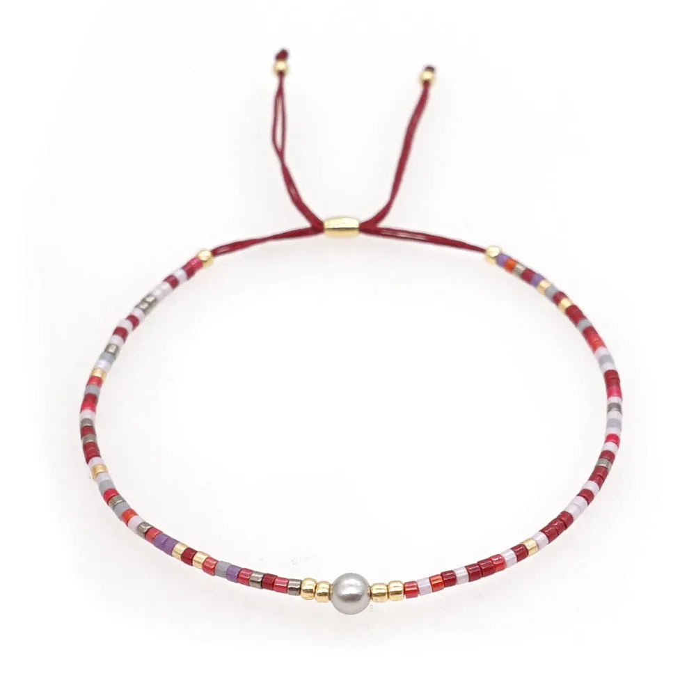 Handmade women's colourful beaded bracelet with glass and glaze beads in Bohemian style.