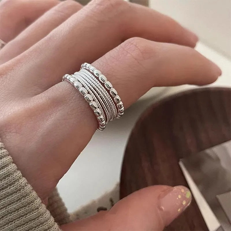 Adjustable geometric copper ring with woven twisted multilayer design