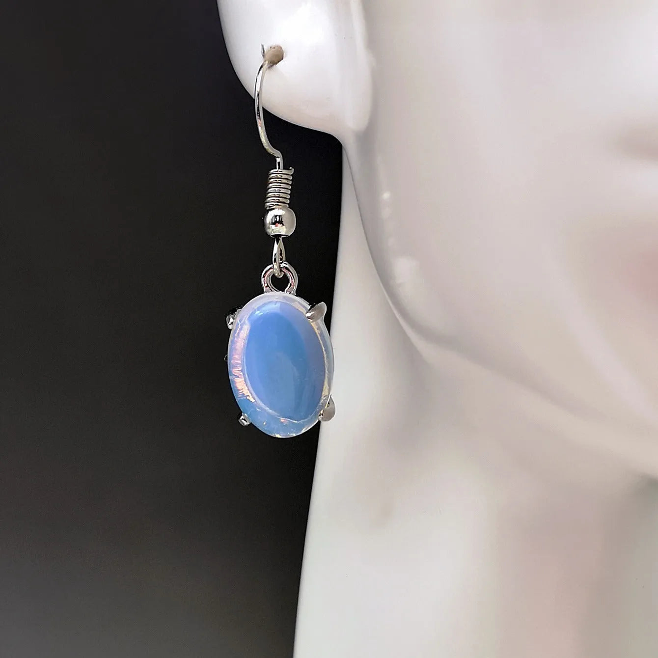 Moonlight white opal earrings with retro drop shape design and ellipse elements