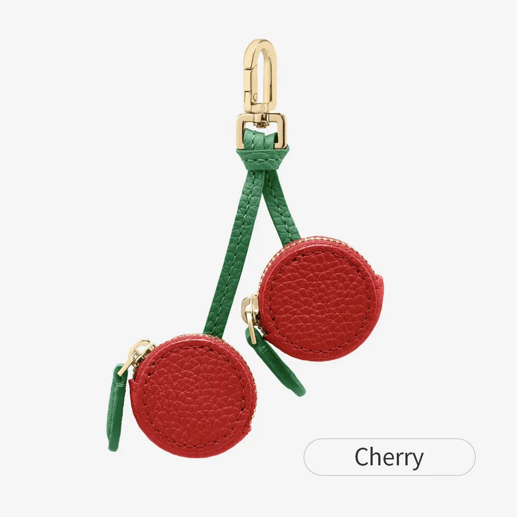 Mini leather coin purse keychain in cherry red colour with zippered closure and keychain attachment