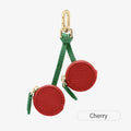 Mini leather coin purse keychain in cherry red colour with zippered closure and keychain attachment