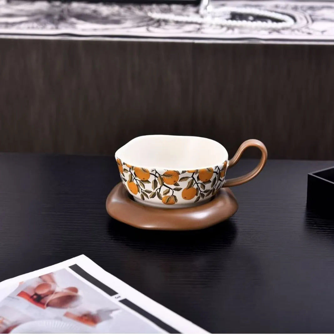 Antique-style ceramic coffee cup and saucer set with 210ml capacity in black or orange retro designs.
