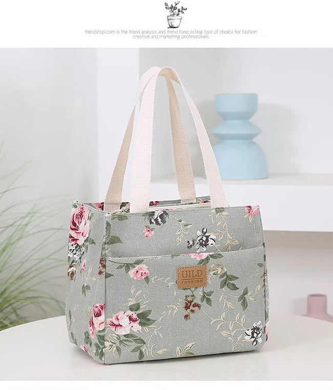 Women's large printed canvas handbag with aluminium base in floral and animal print designs.
