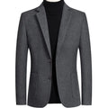 Men's slim fit wool suit jacket in grey on a hanger