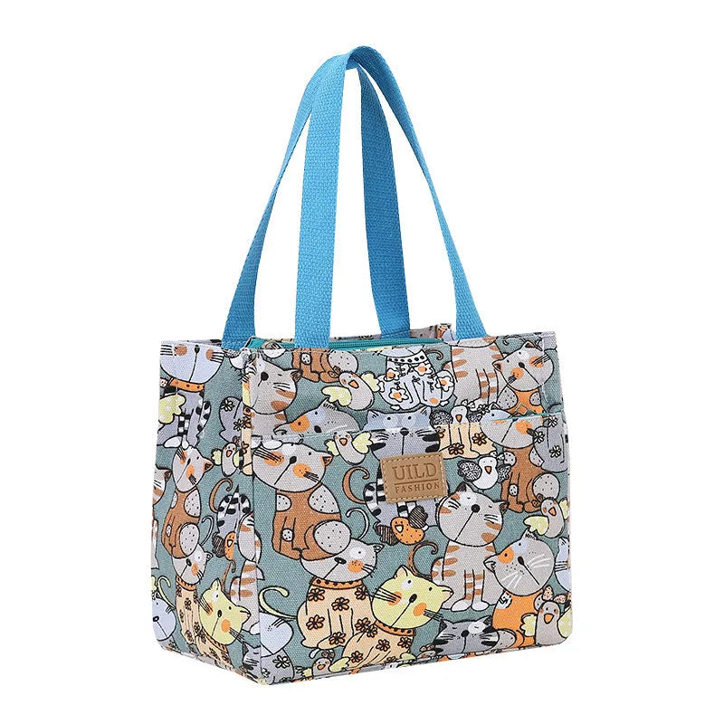 Women's large printed canvas handbag with aluminium base in floral and animal print designs.