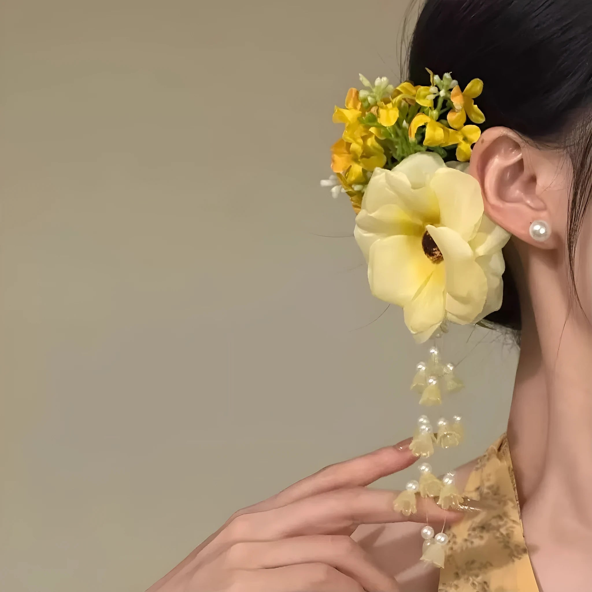 Yellow flower tassel side clip hair accessory with mixed material construction and manual processing details
