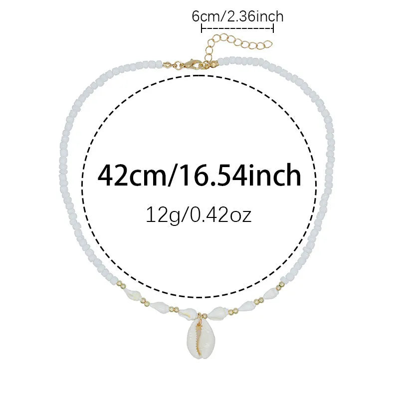 White bead necklace with conch-shaped mother of pearl shellfish pendant and regular chain