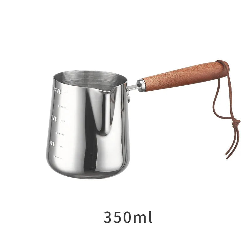 Stainless steel coffee cup with wooden scaled handle showing measurement markings