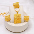 Gold tone wedding jewellery set showing necklace, earrings and ring on display