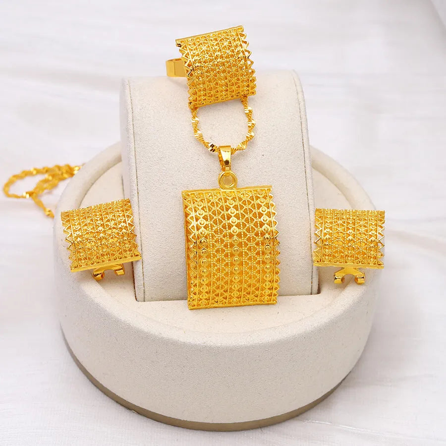 Gold tone wedding jewellery set showing necklace, earrings and ring on display