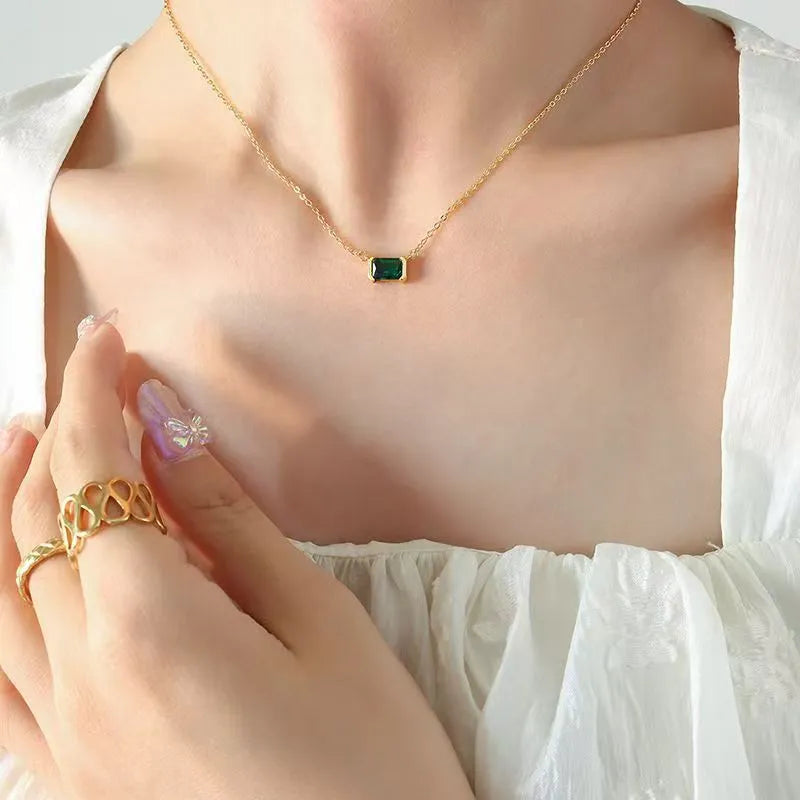 Gold geometric pendant necklace with quadrilateral design and inlaid Lvzuan stones on chain
