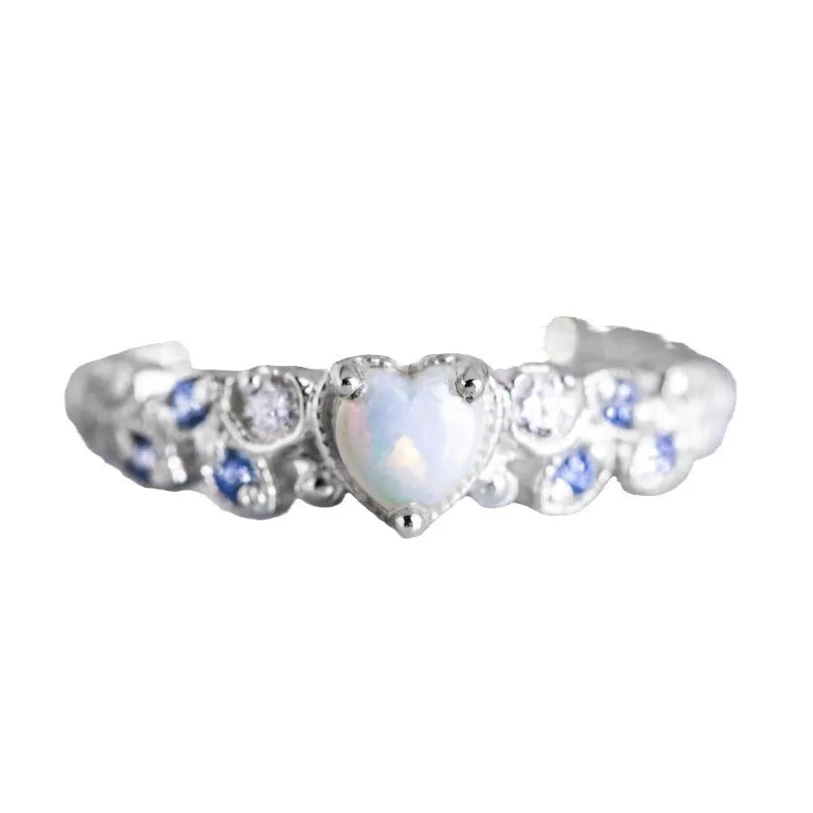 White alloy women's ring with a peach-coloured heart-shaped centrepiece.