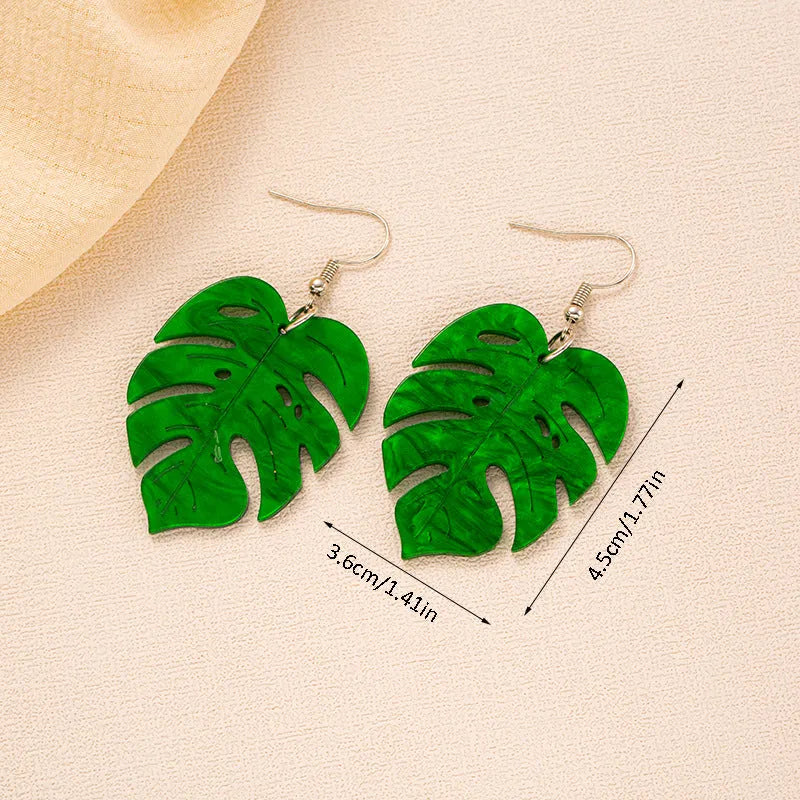Alloy drop earrings with a blue acrylic artocarpus heterophyllus design and hook fastening.
