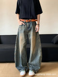 Retro blue men's distressed wide-leg jeans on a neutral background, showing machete detailing and mid-waist zip fly.