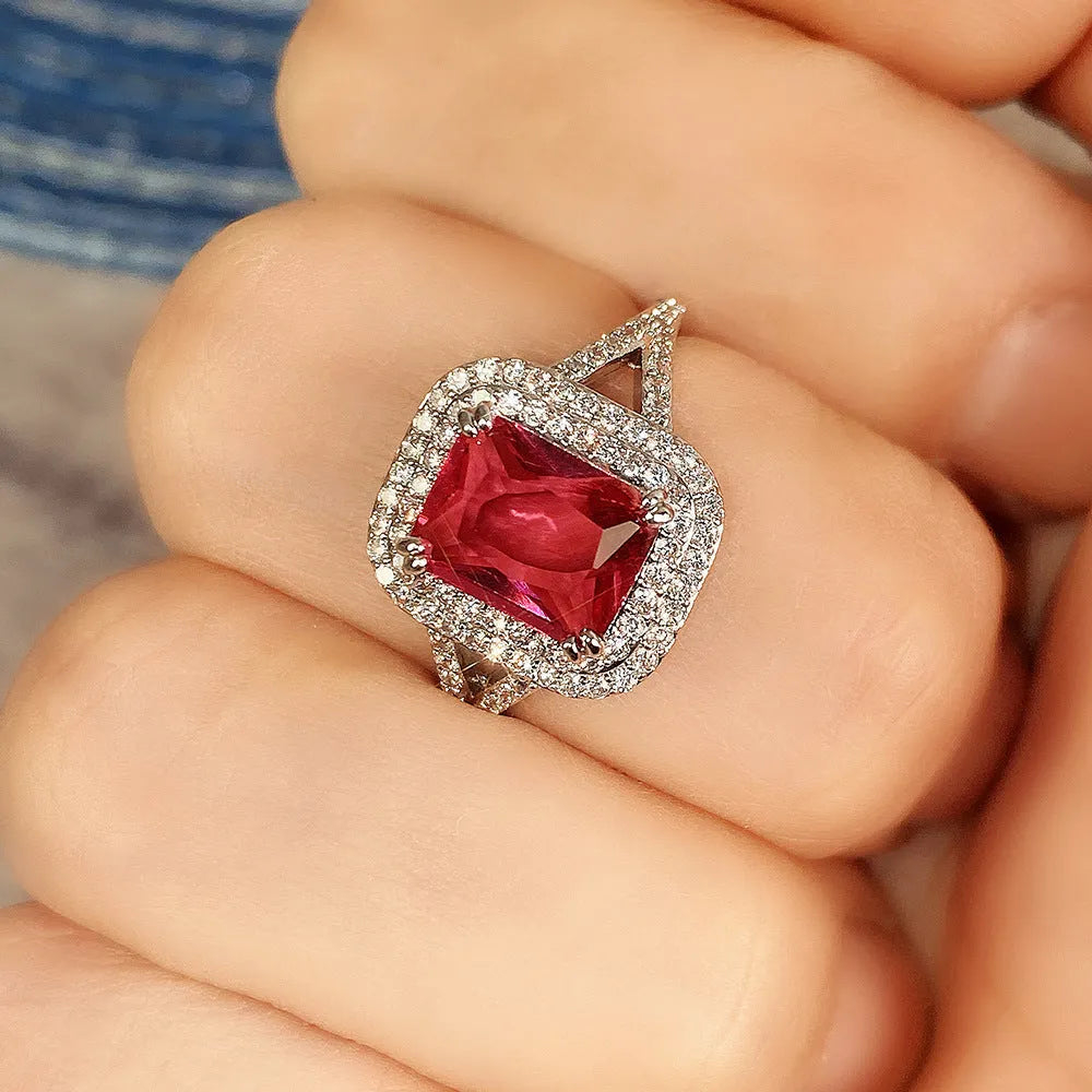 Red copper women's ring with square geometric face and clear rhinestones.