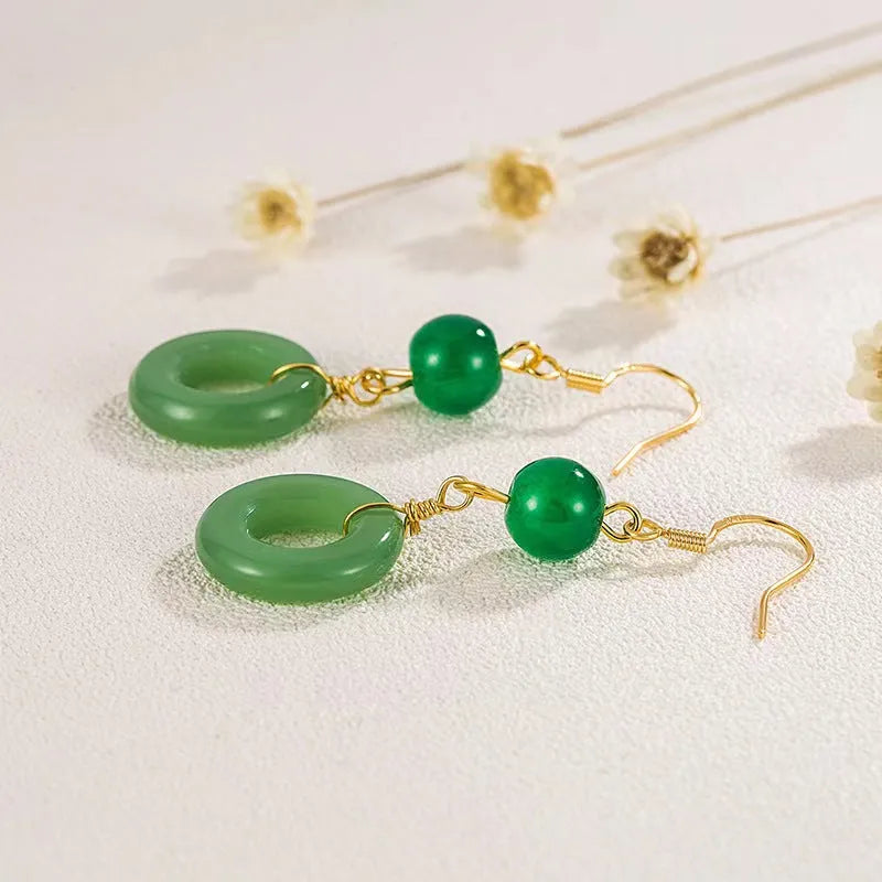 Pair of green Chinese style peace buckle geometric earrings with gold plating.