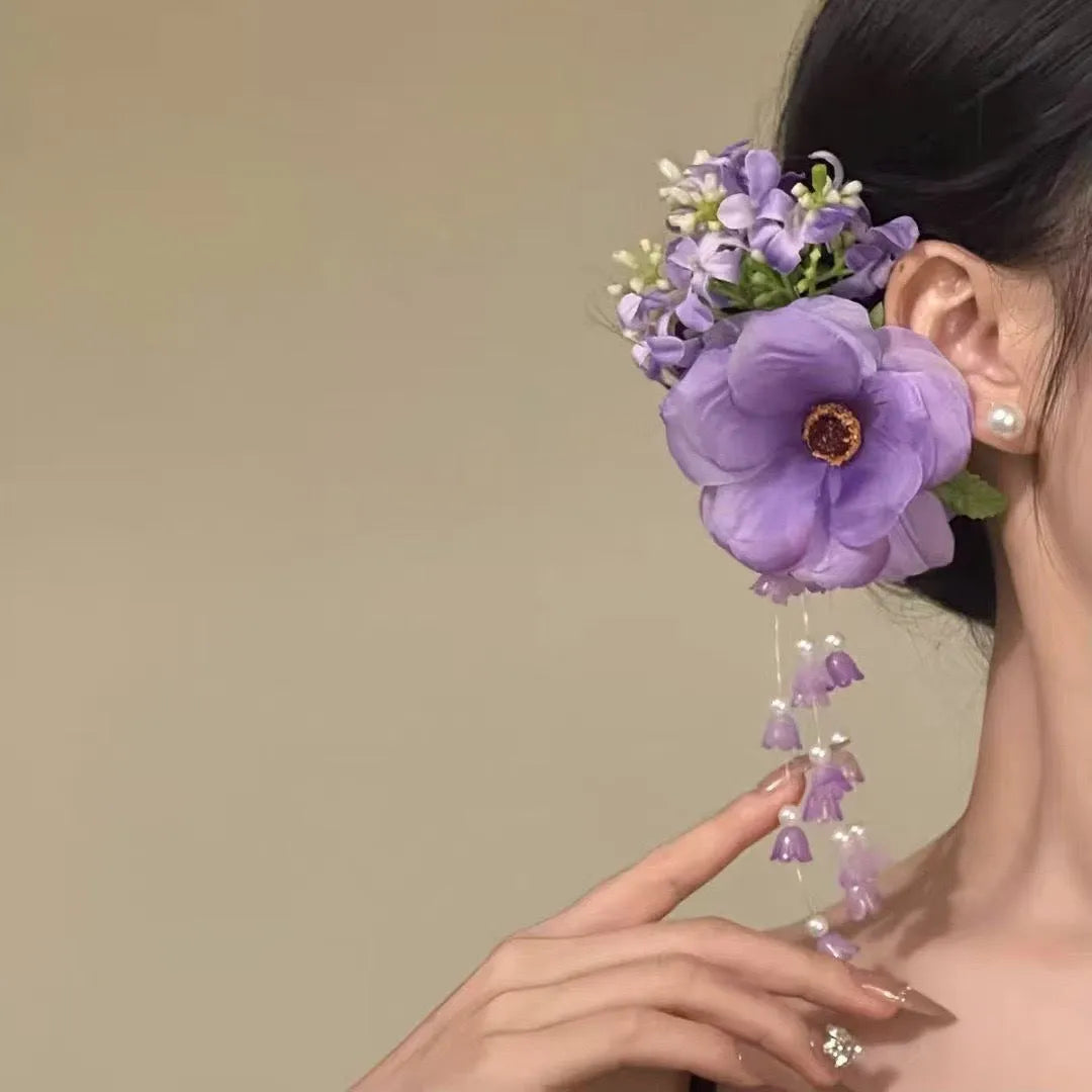 Yellow flower tassel side clip hair accessory with mixed material construction and manual processing details