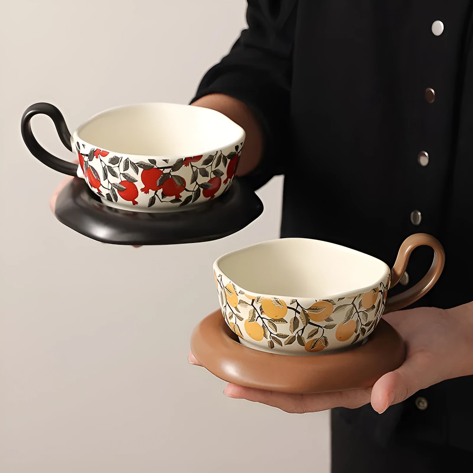 Antique-style ceramic coffee cup and saucer set with 210ml capacity in black or orange retro designs.