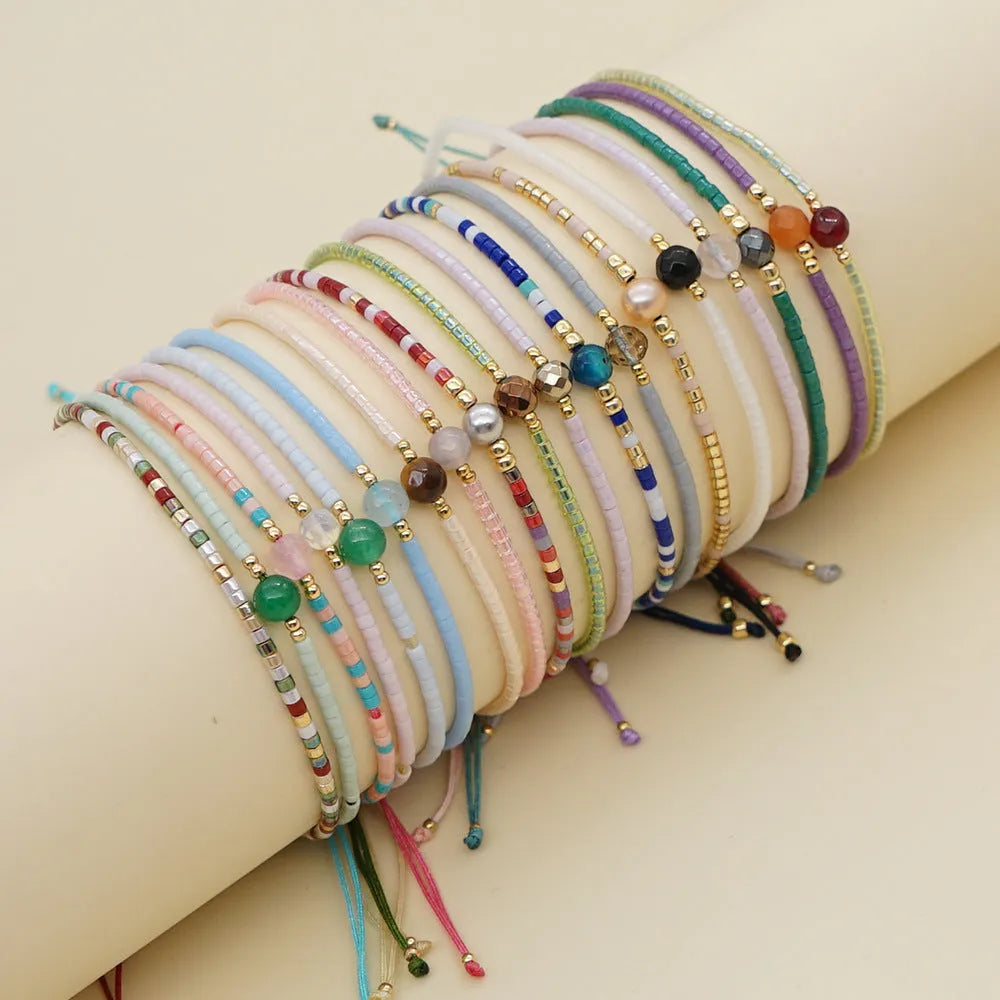 Handmade women's colourful beaded bracelet with glass and glaze beads in Bohemian style.