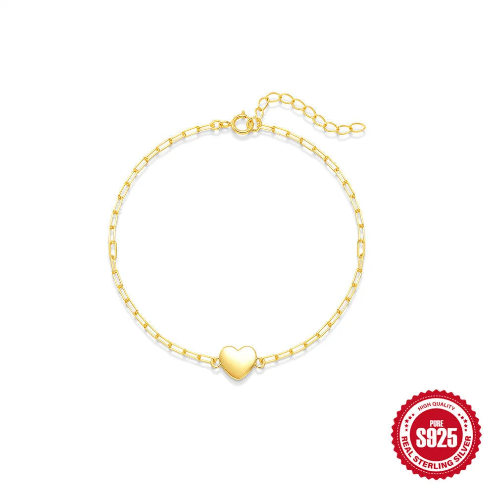 Gold tone S925 sterling silver bracelet with clip chain and glossy heart charm