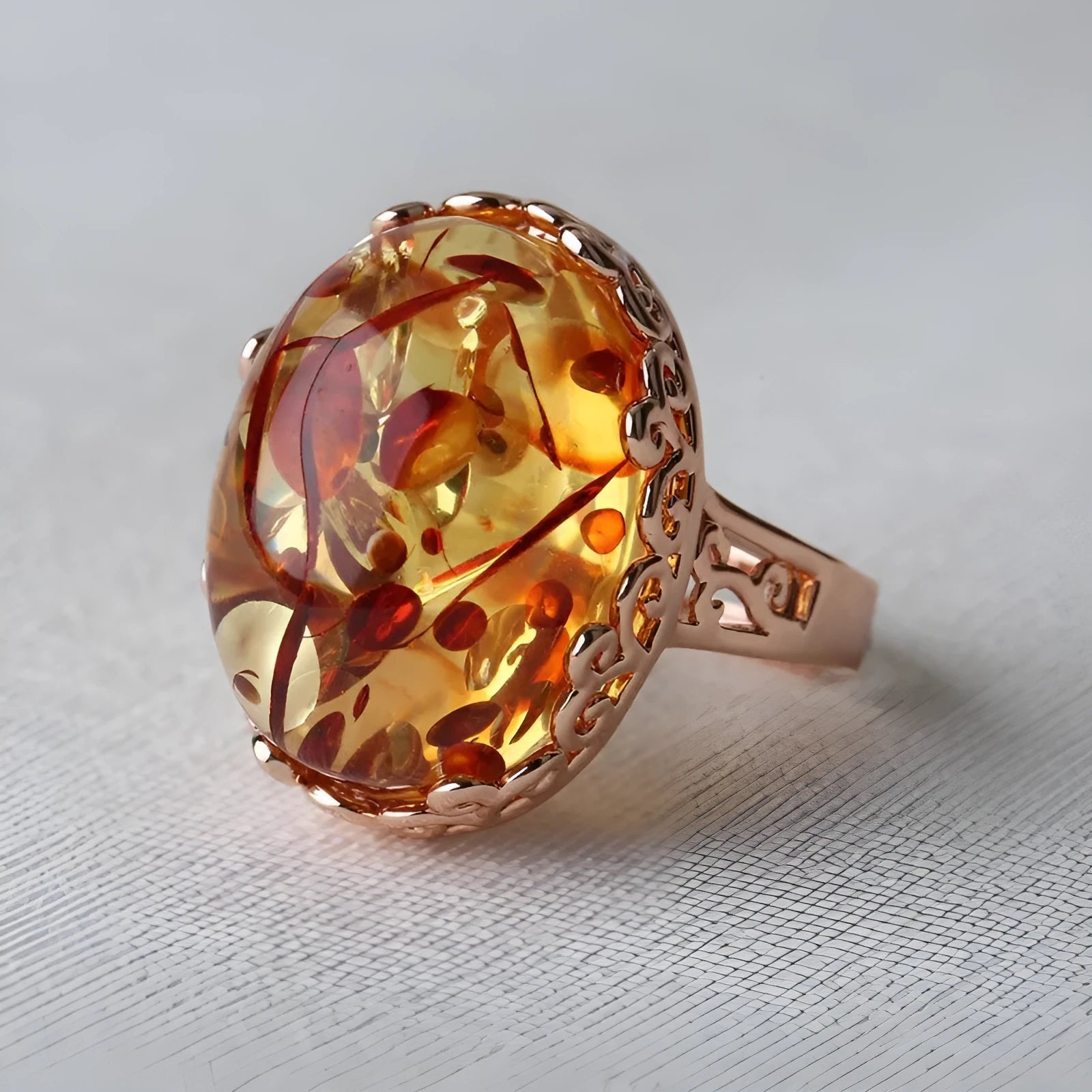Beeswax amber ring with an alloy band in an ethnic style, colour New Amber Type A.