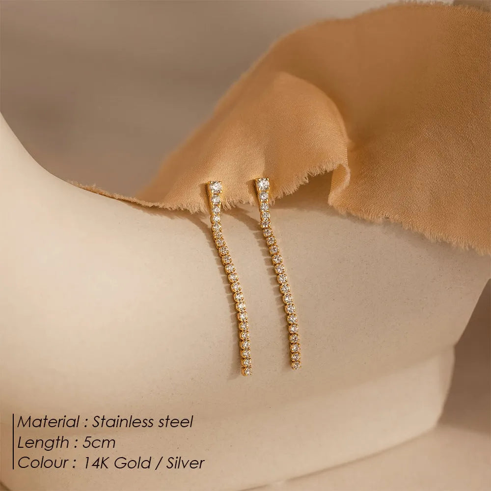 Geometric stainless steel earrings with linear Chinese-style design in gold and steel colours