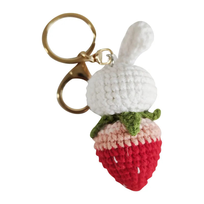 Colourful hand-woven wire rabbit strawberry pendant on a keyring