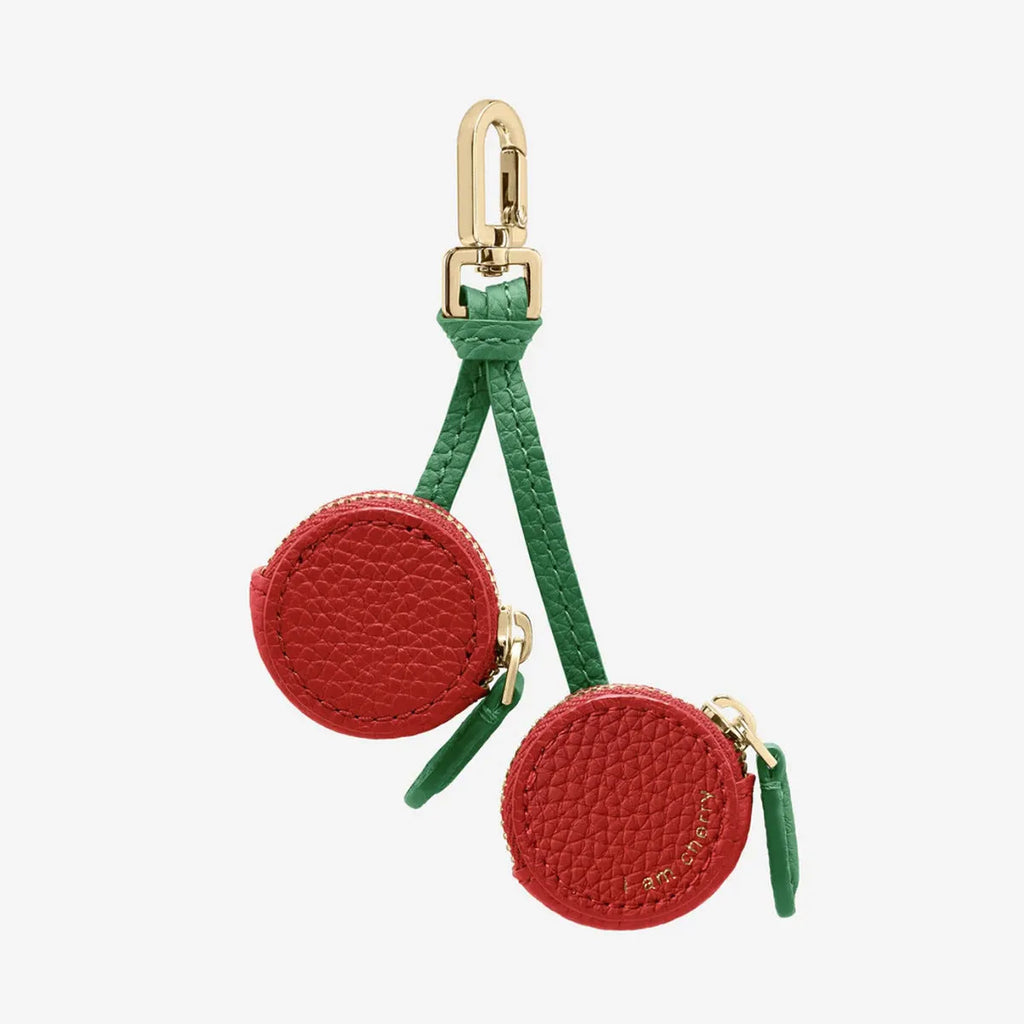 Mini leather coin purse keychain in cherry red colour with zippered closure and keychain attachment
