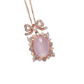 Rose gold plated geometric pendant with pink rose quartz stone on a silver chain.