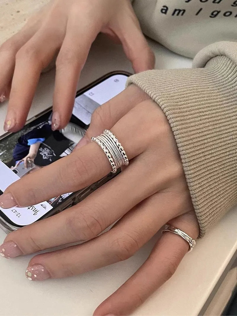 Adjustable geometric copper ring with woven twisted multilayer design