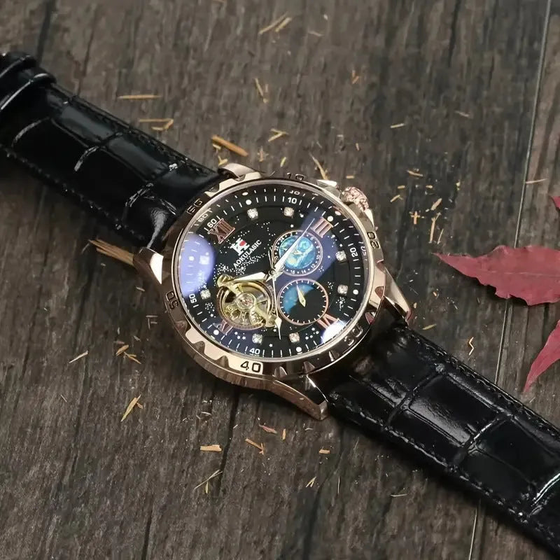 Men's black and rose gold automatic skeleton watch on leather strap.