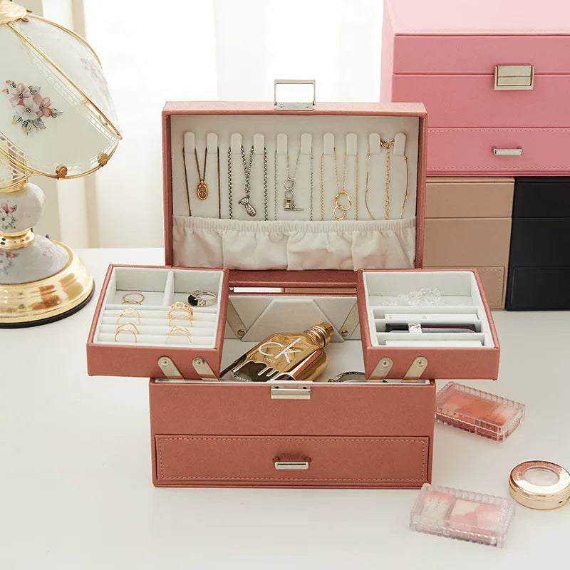 Hard leather jewellery storage box in beige with organiser compartments for rings and necklaces.