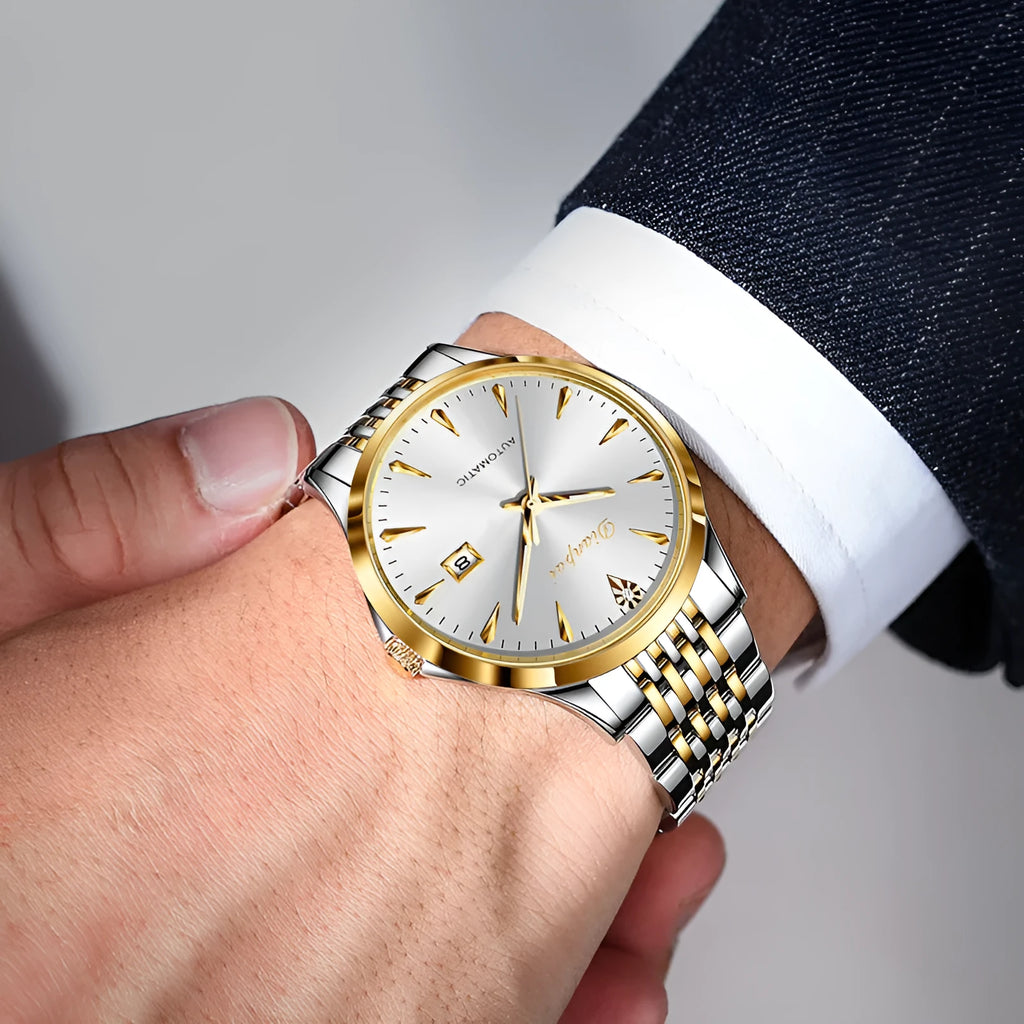 Men's stainless steel automatic watch with a simple white dial on wrist.